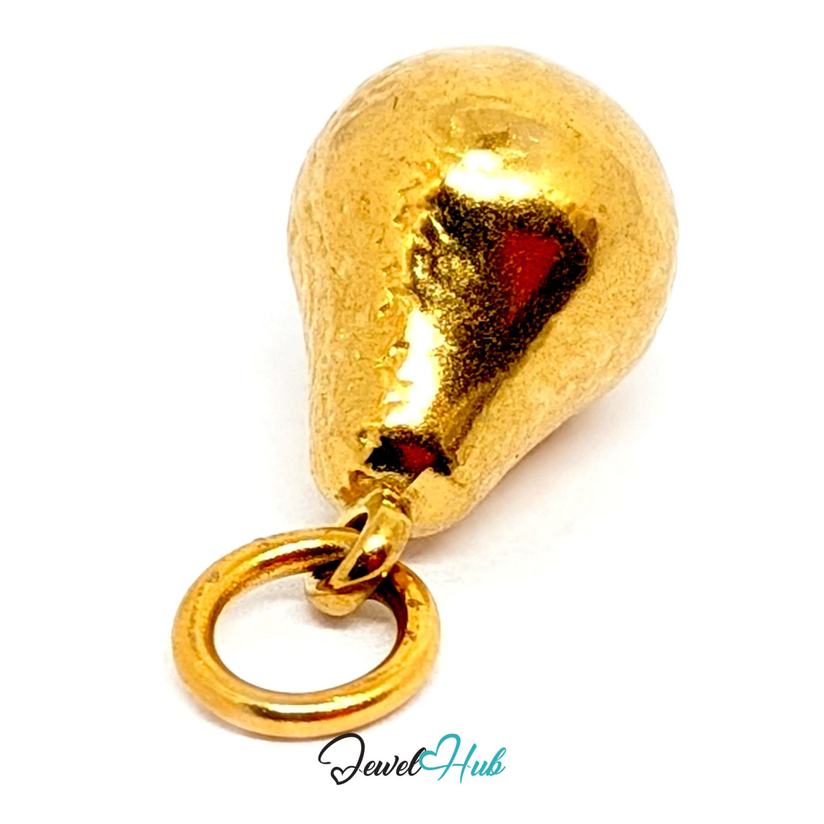 Close-up of the gold-tone hammered pear charm detail - JewelHub