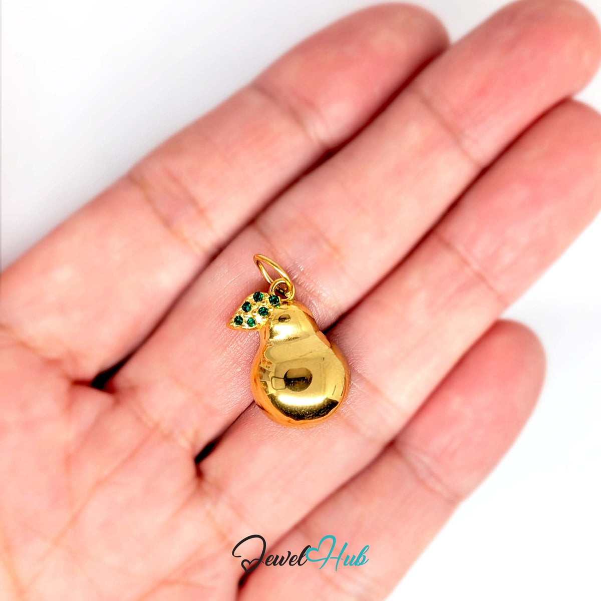 Crystal leaf pear charm held in a hand to show its size - JewelHub
