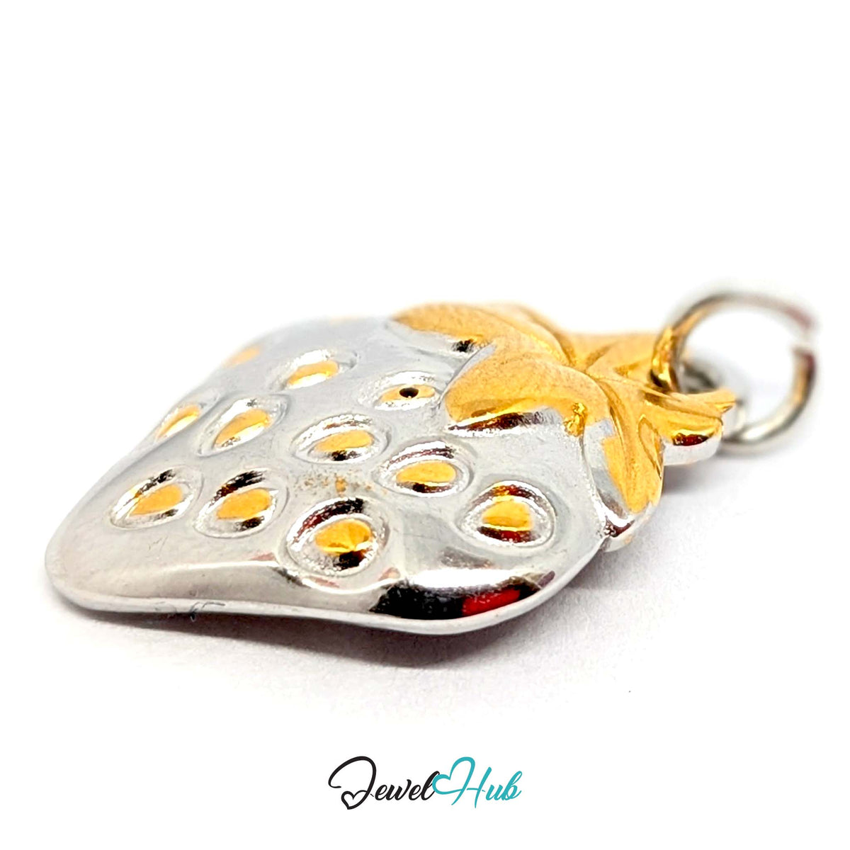 Angled view of the silver-tone two-tone strawberry charm - JewelHub
