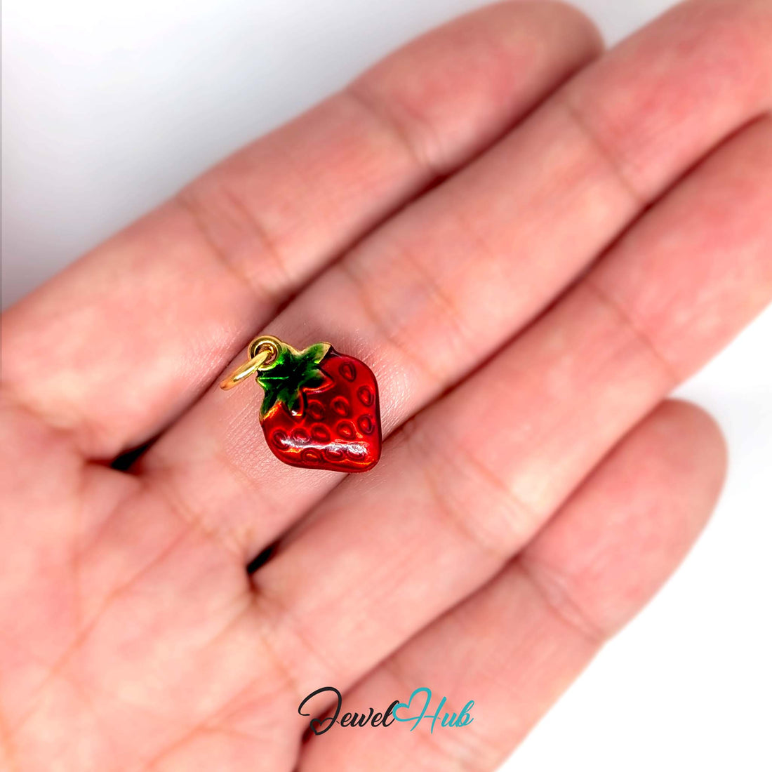 Red enamel strawberry charm in gold-tone stainless steel - JewelHub