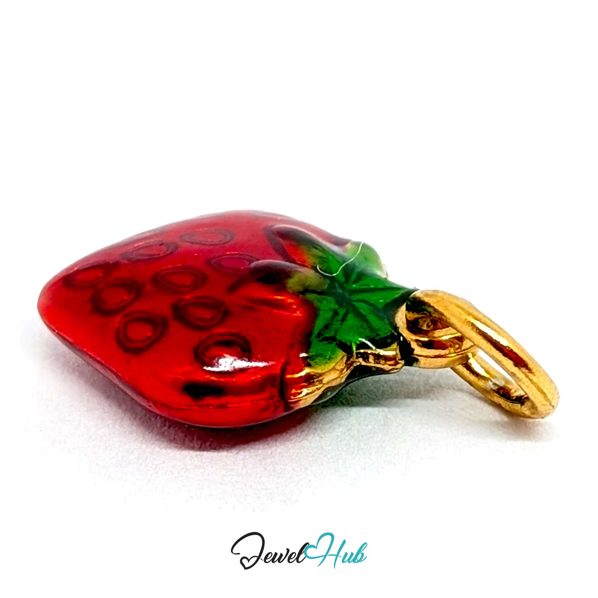Close-up of the gold-tone red enamel strawberry charm detail - JewelHub