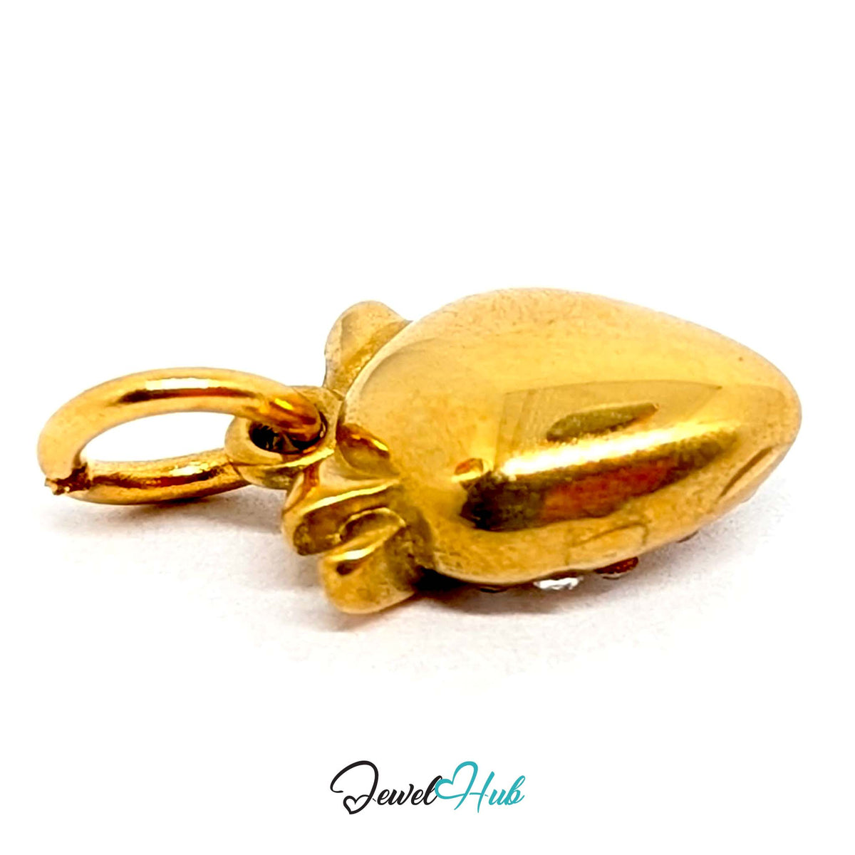 Close-up of the gold-tone crystal strawberry charm detail - JewelHub