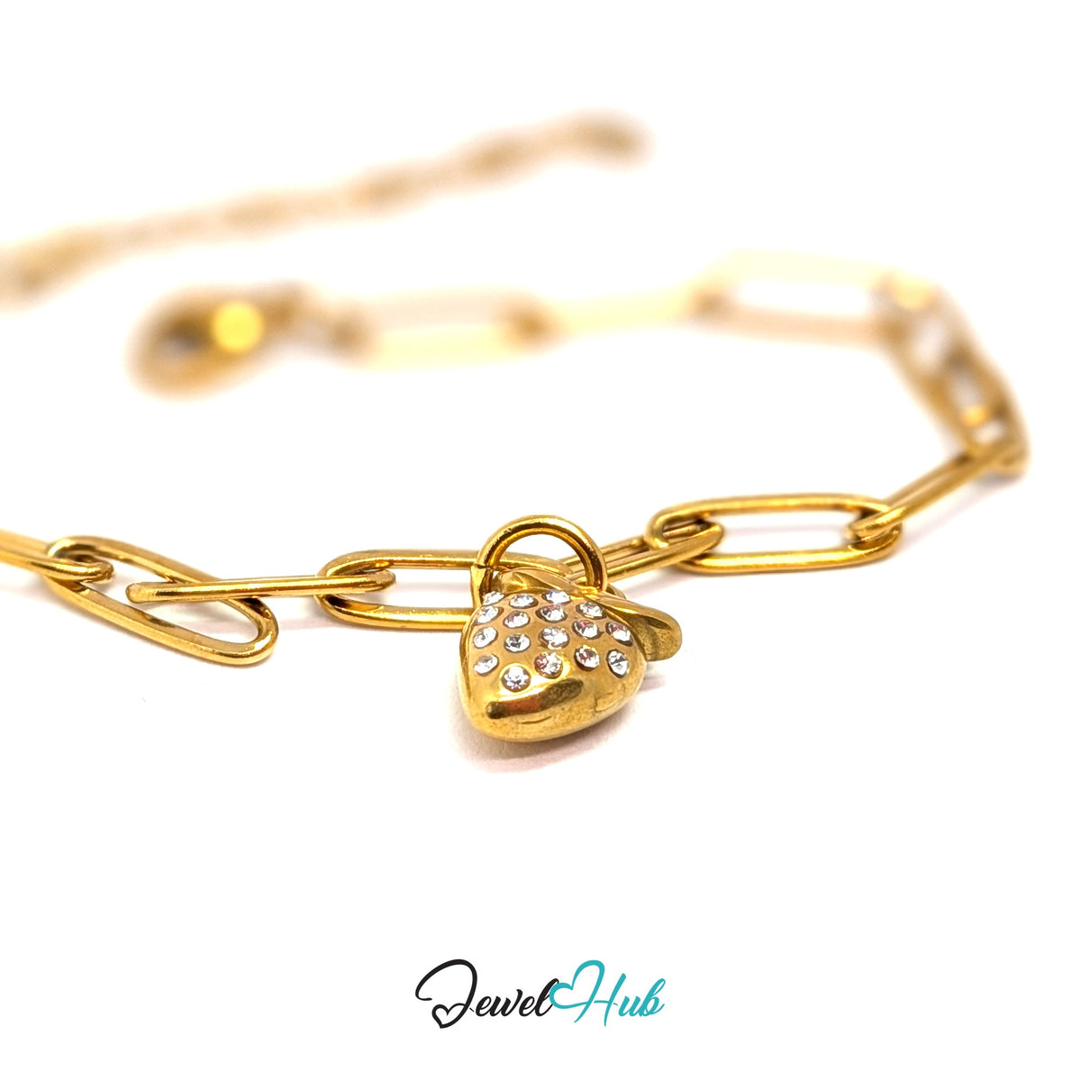 Gold-tone crystal strawberry charm styled on a gold paperclip chain bracelet - JewelHub