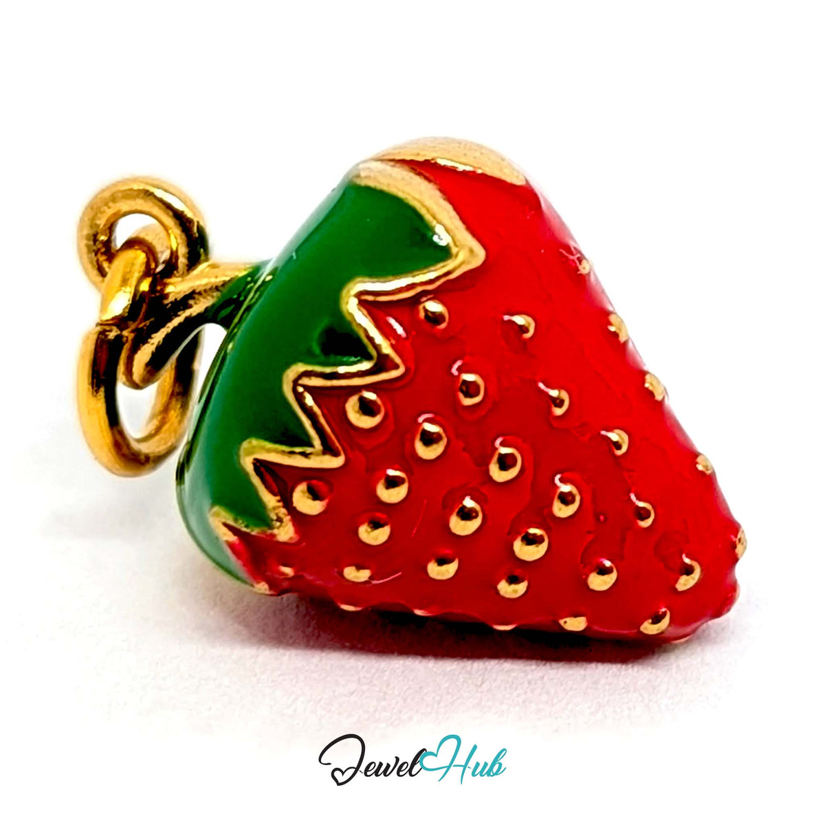 Angled view of the gold-tone 3D red enamel strawberry charm - JewelHub