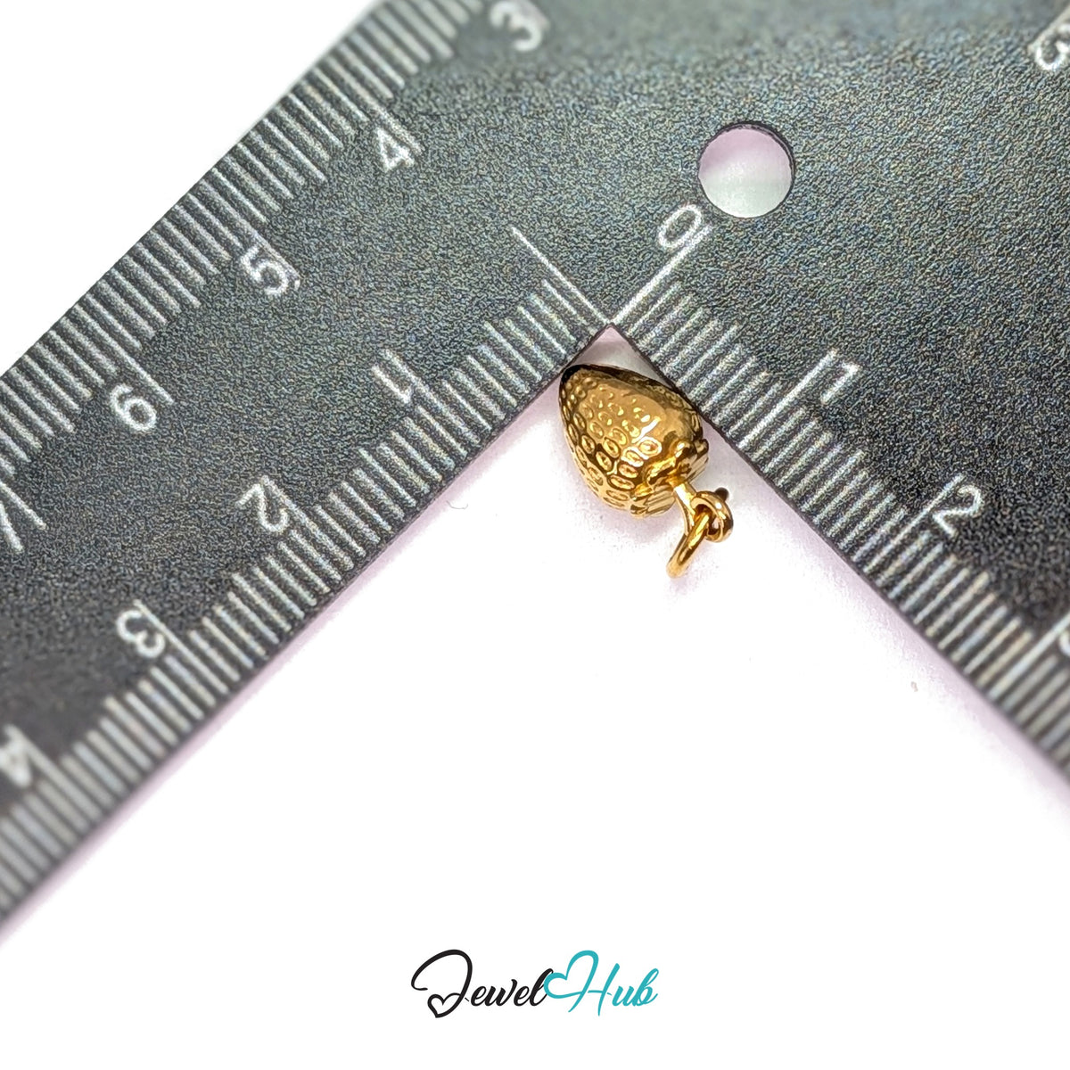 Mini 3D strawberry charm measured against a ruler at 7.8mm wide by 13.6mm tall - JewelHub