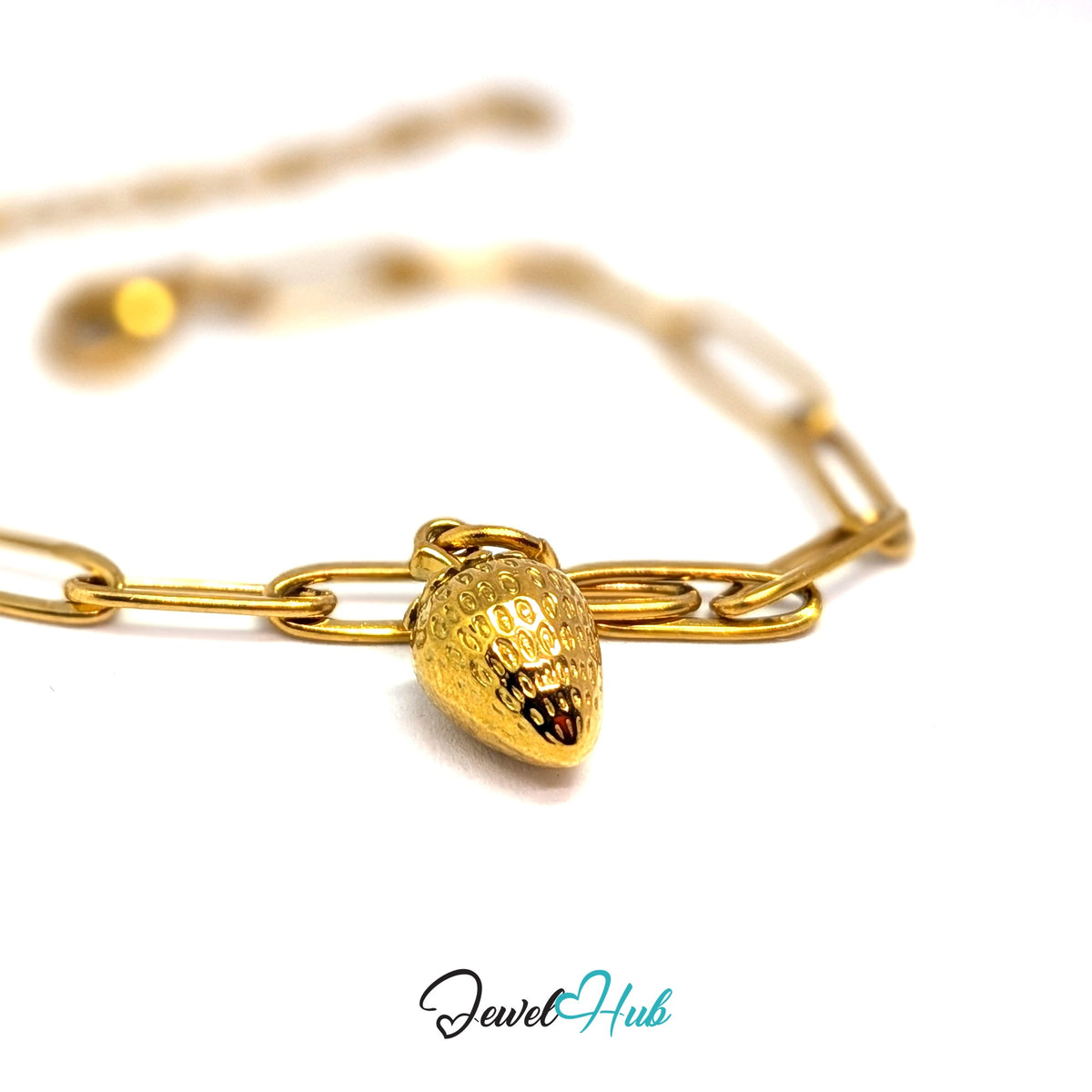 Gold-tone mini 3D strawberry charm styled on a gold paperclip chain bracelet - JewelHub