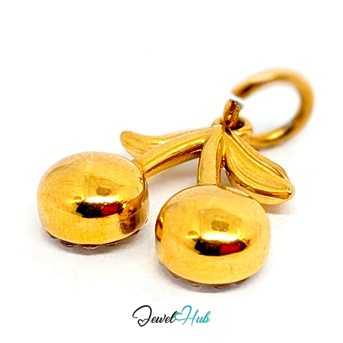 Close-up of the gold-tone crystal cherry charm detail - JewelHub