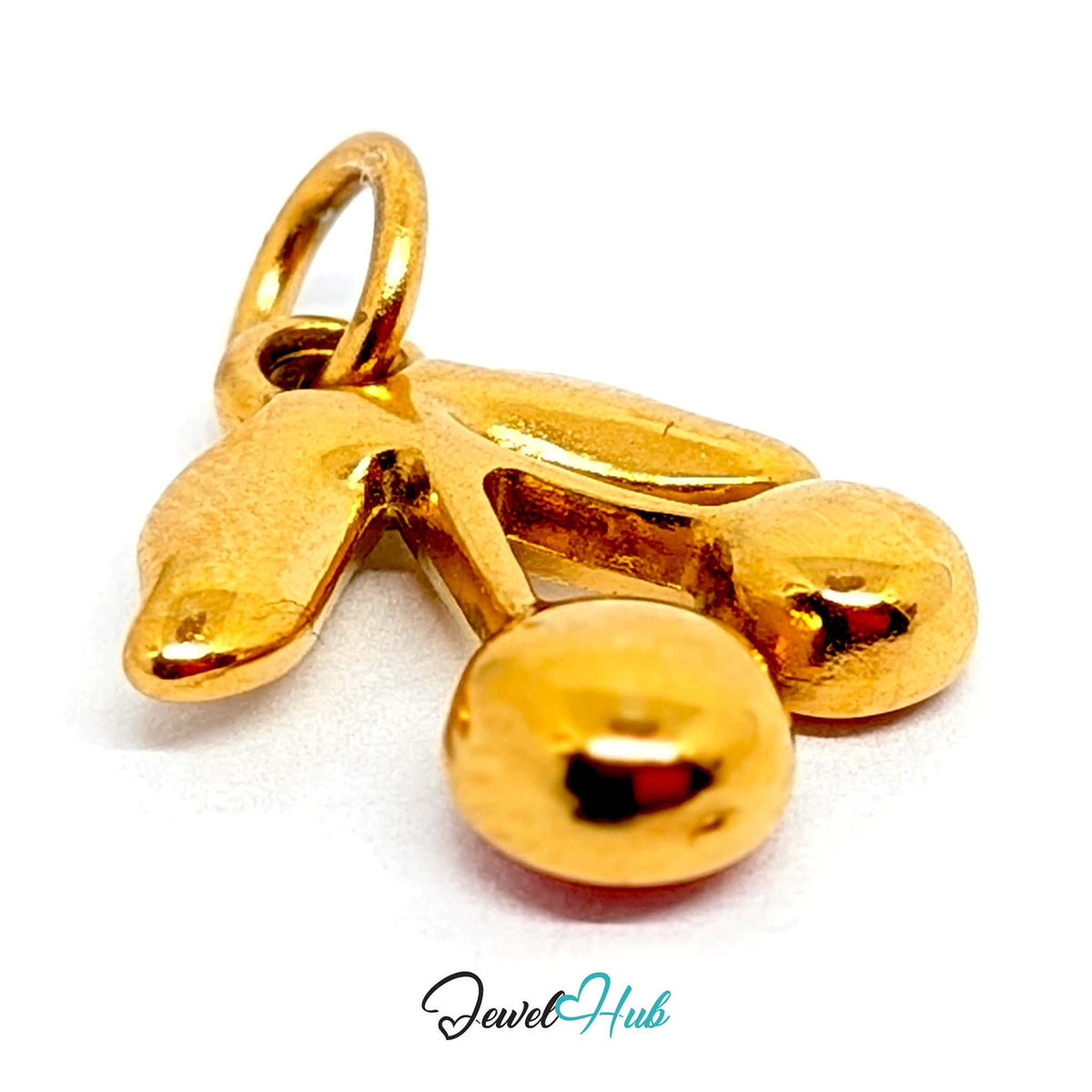 Close-up of the gold-tone red gem cherry charm detail - JewelHub