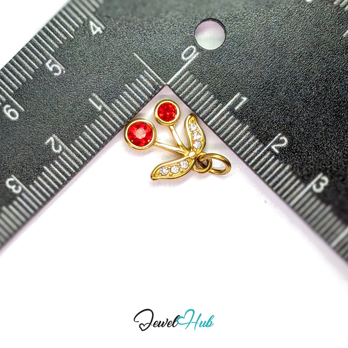 Red gem cherry charm measured against a ruler at 13.8mm wide by 15.4mm tall - JewelHub