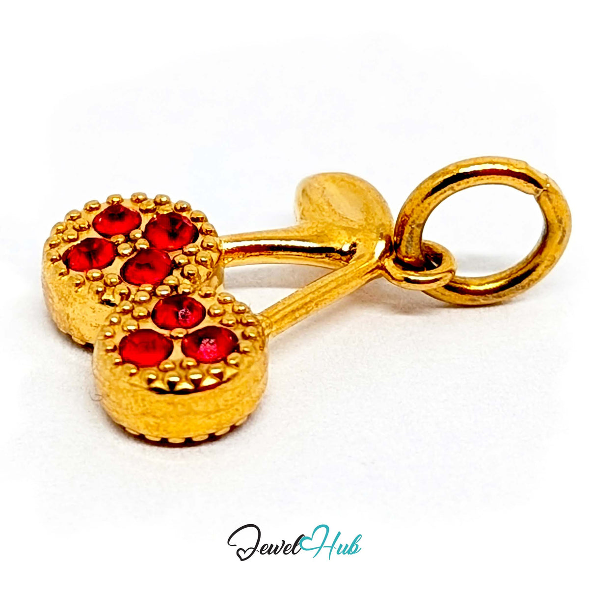 Angled view of the gold-tone red stone cluster cherry charm - JewelHub
