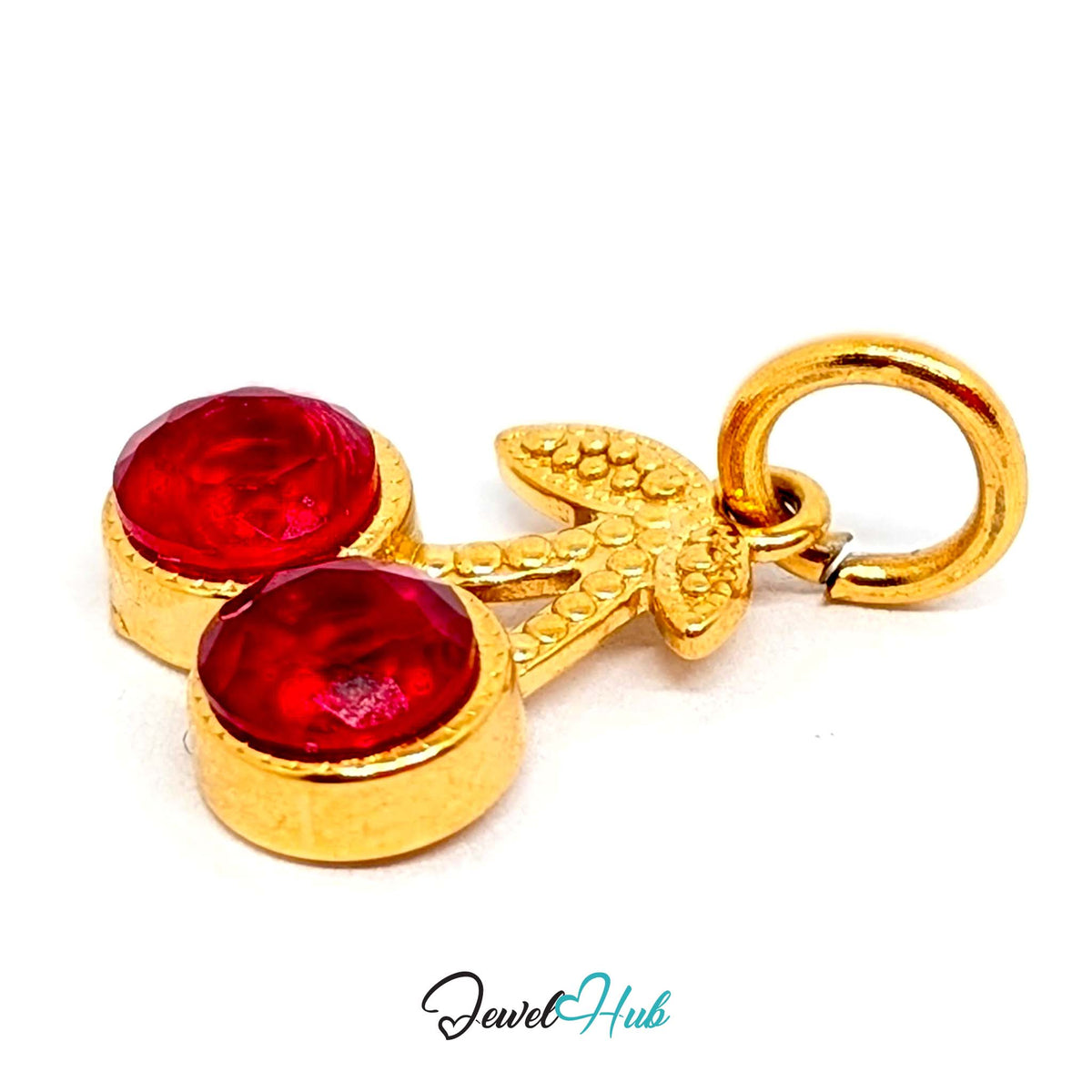 Angled view of the gold-tone big red gem cherry charm - JewelHub