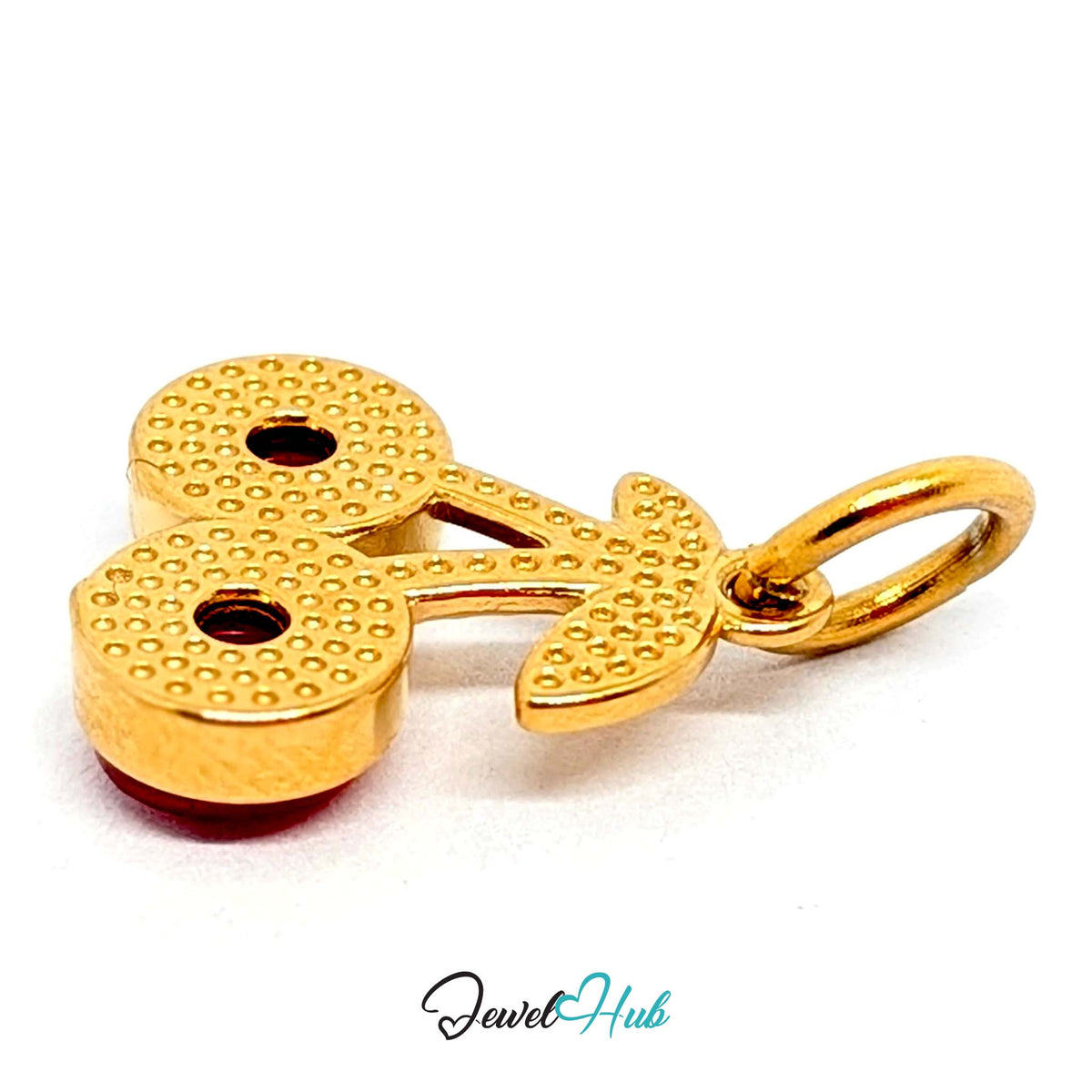 Close-up of the gold-tone big red gem cherry charm detail - JewelHub