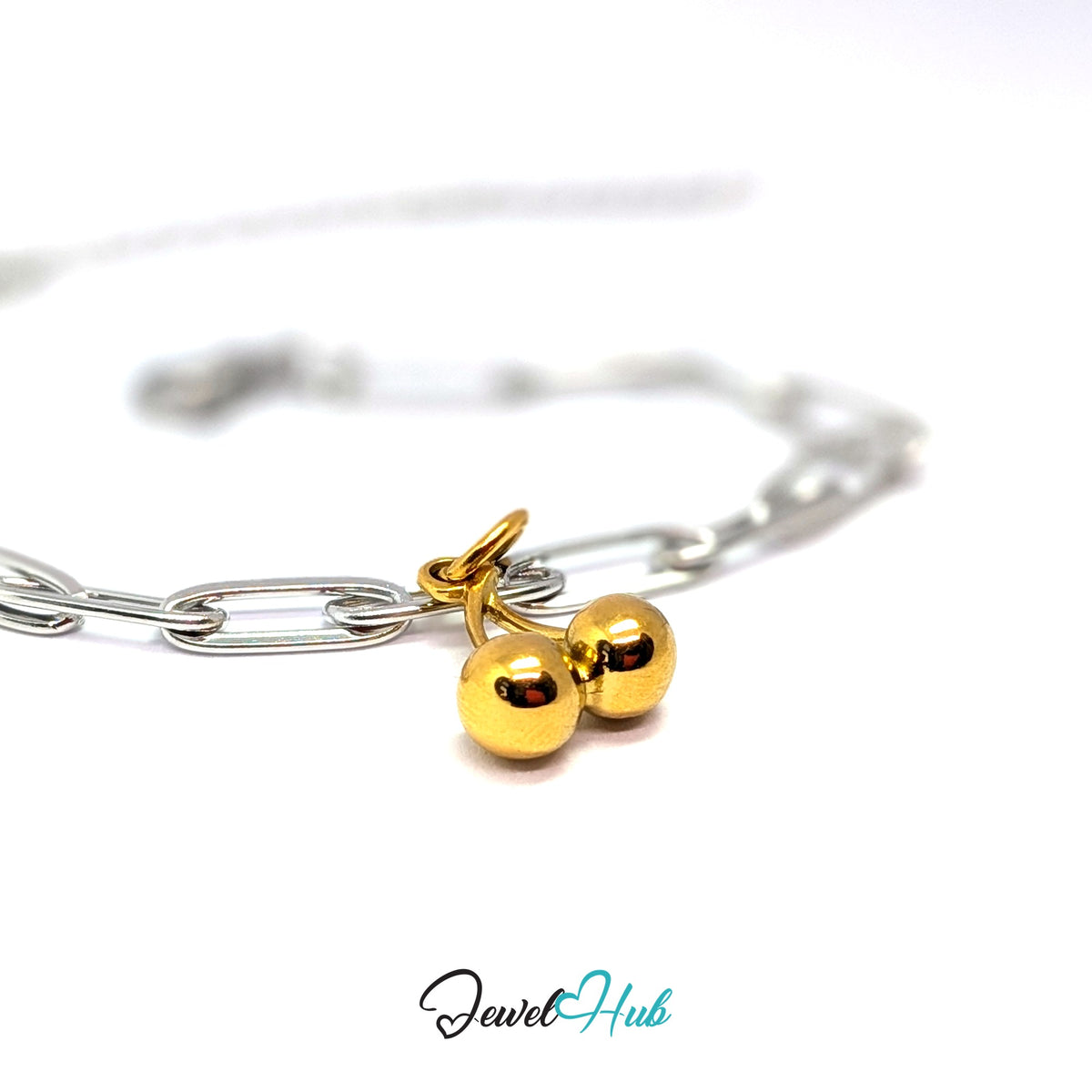 Gold-tone polished cherry charm styled on a silver paperclip chain bracelet for a two-tone look - JewelHub