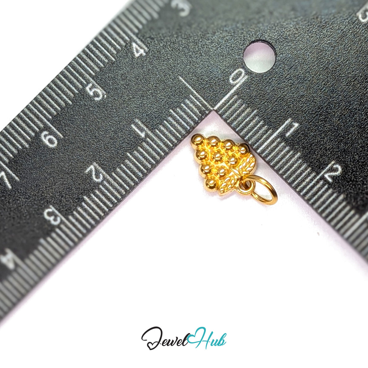 Beaded grape bunch charm measured against a ruler at 9.5mm wide by 13.8mm tall - JewelHub