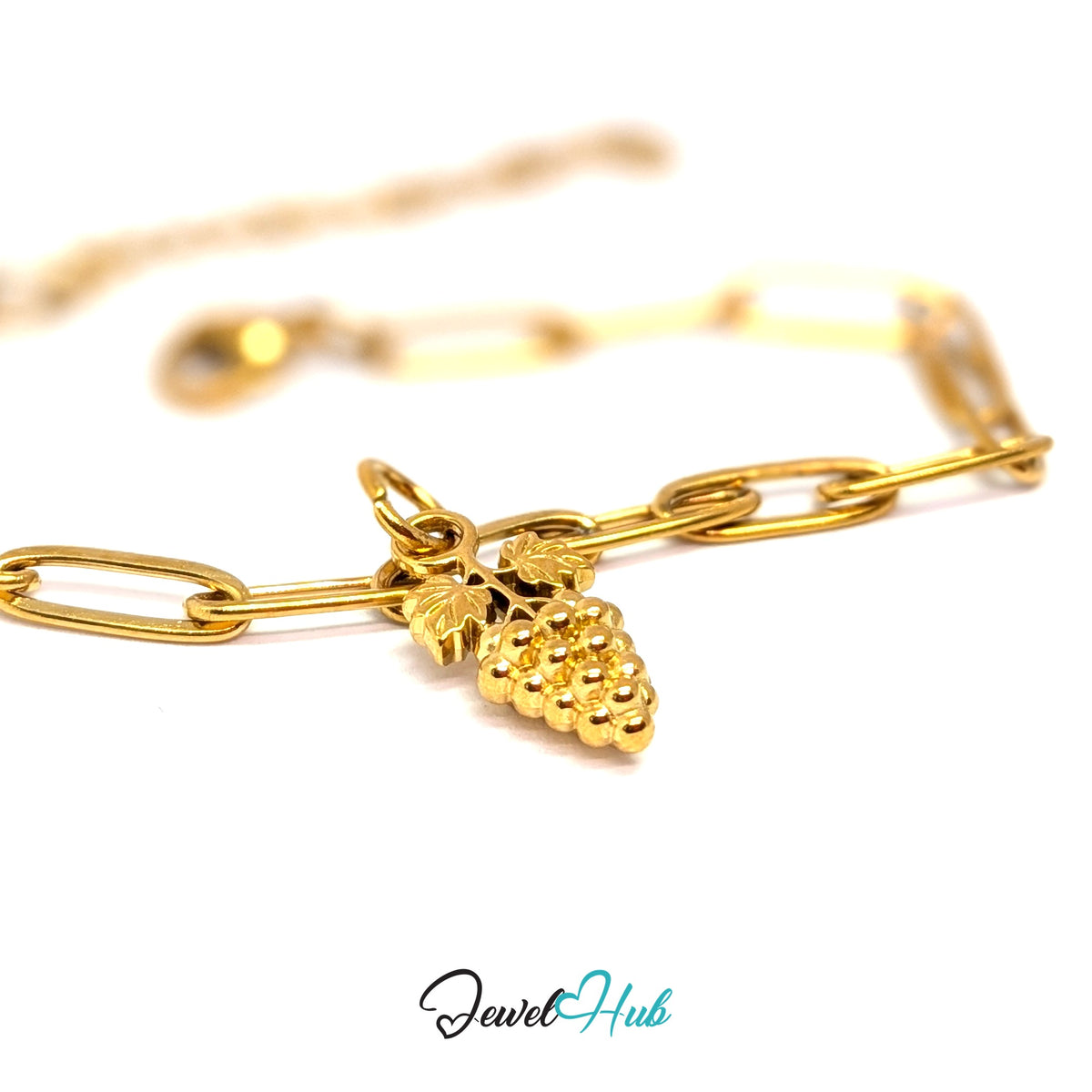 Gold-tone grape bunch with leaves charm styled on a gold paperclip chain bracelet - JewelHub