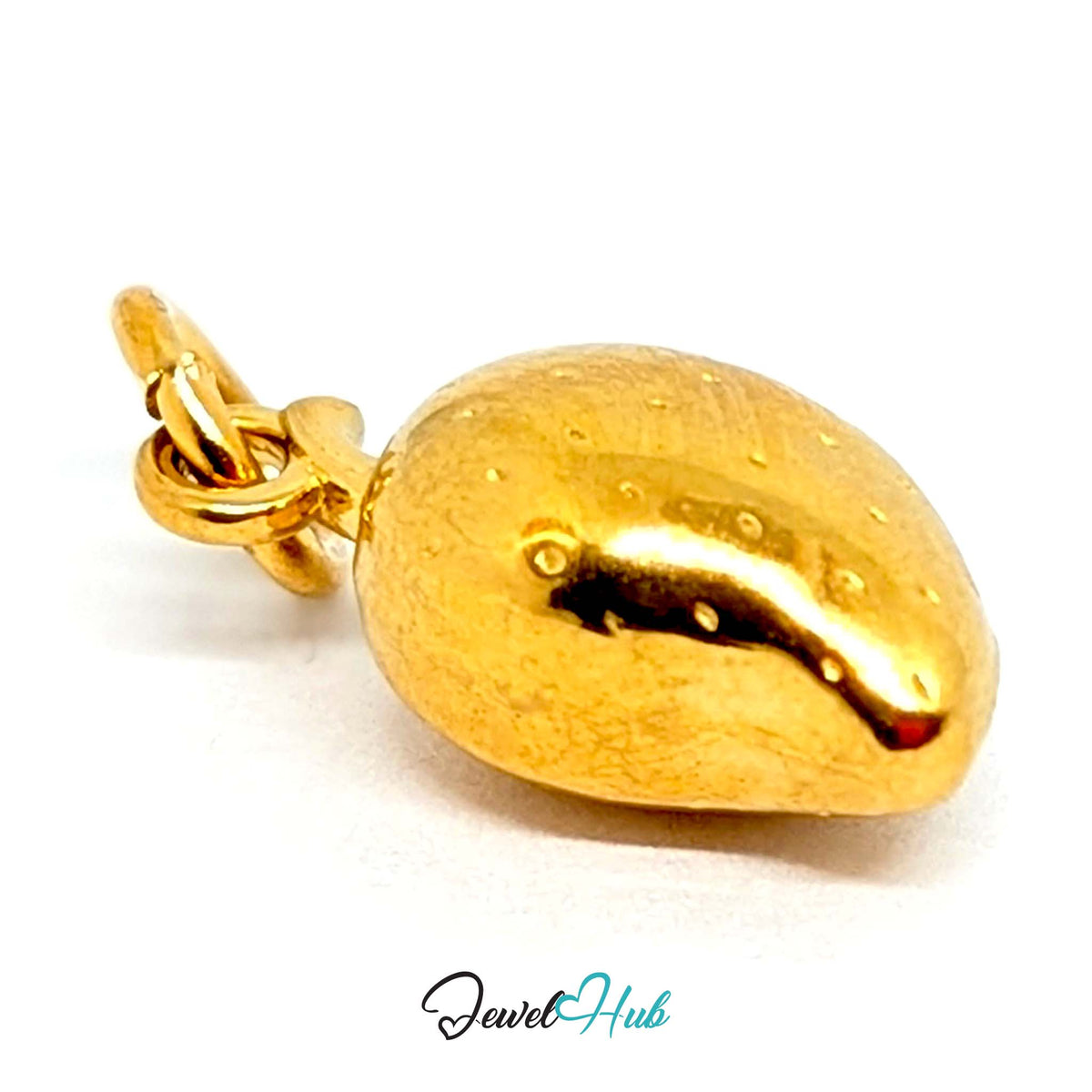 Close-up of the gold-tone mango charm detail - JewelHub