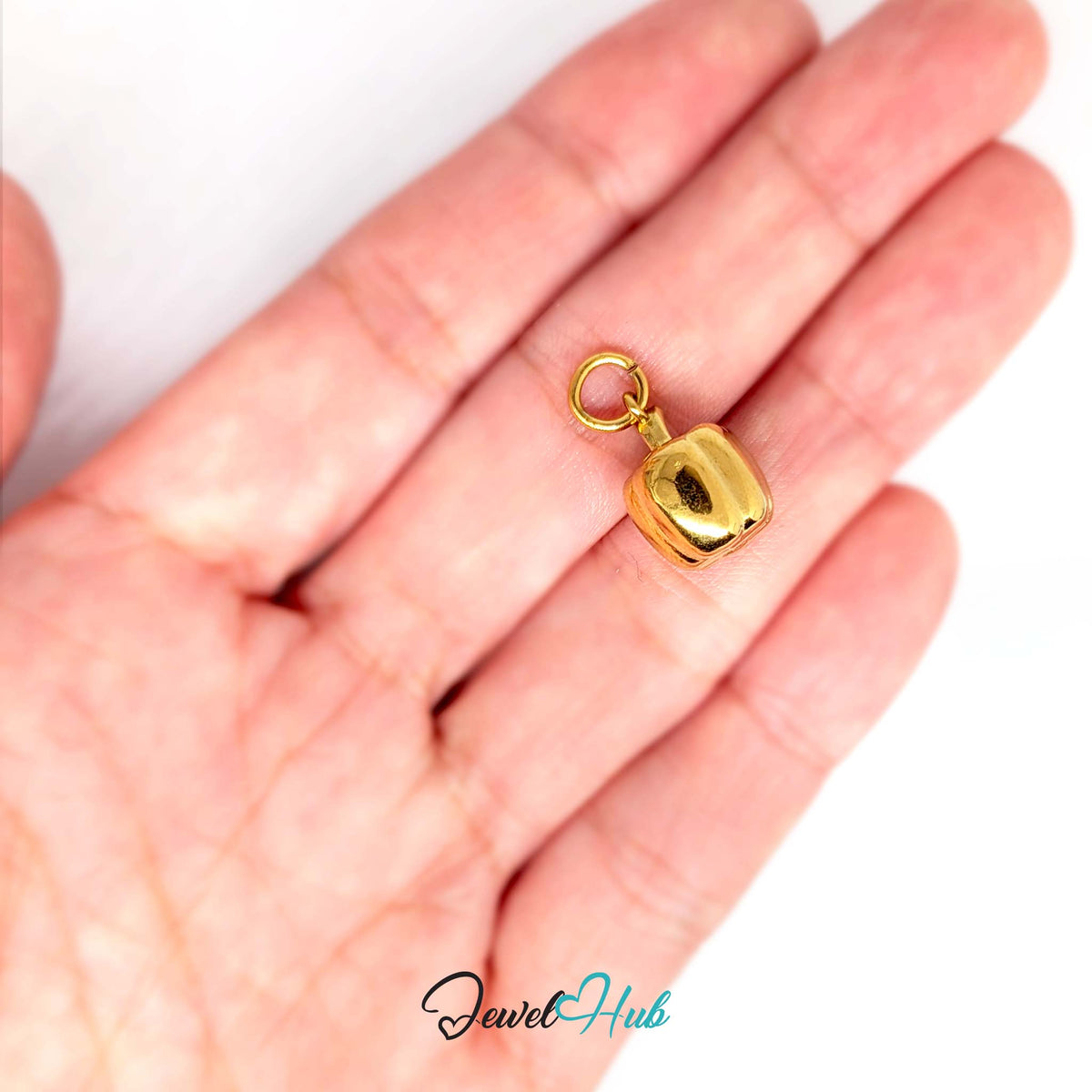 Bell pepper charm held in a hand to show its size - JewelHub