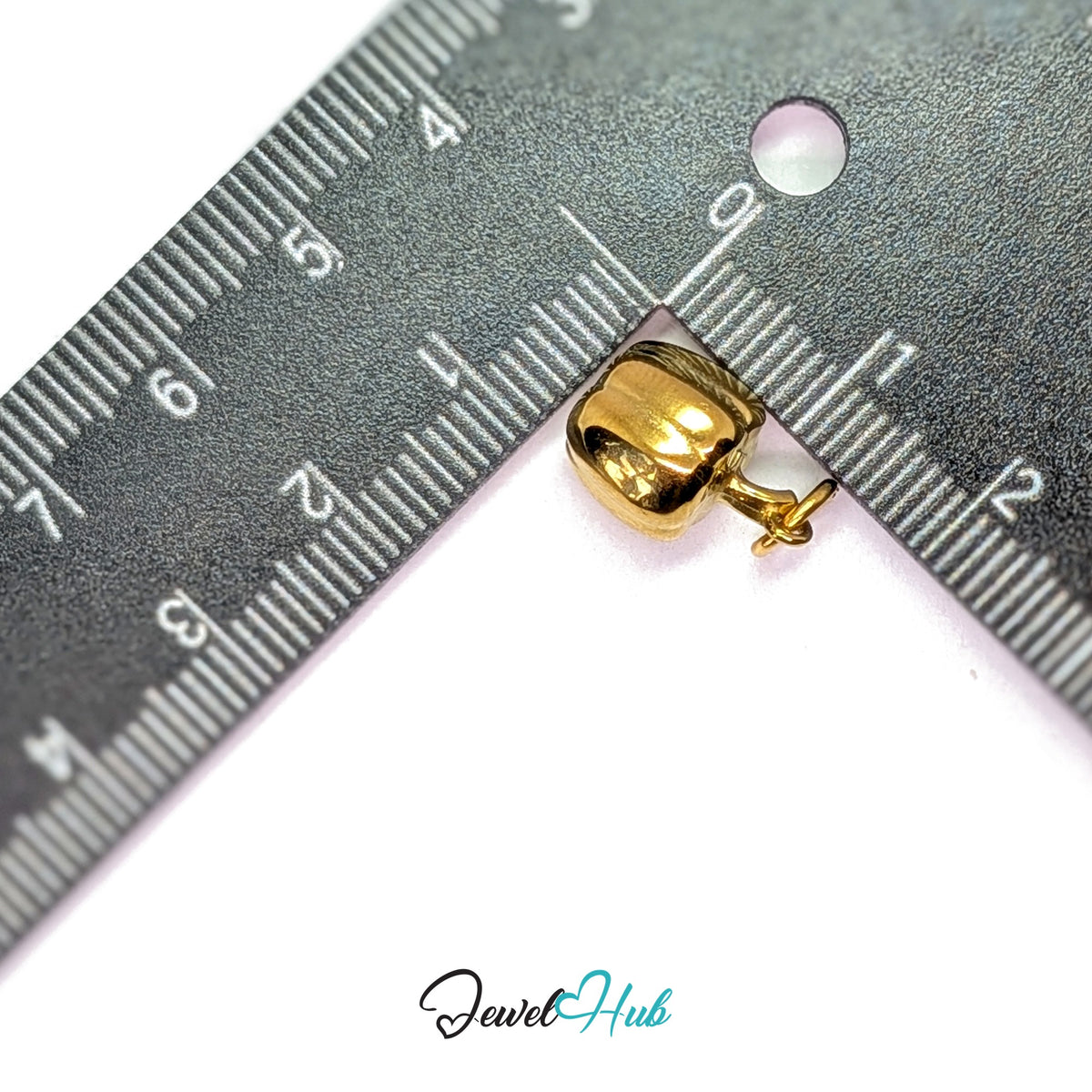 Bell pepper charm measured against a ruler at 9.8mm wide by 14.7mm tall - JewelHub