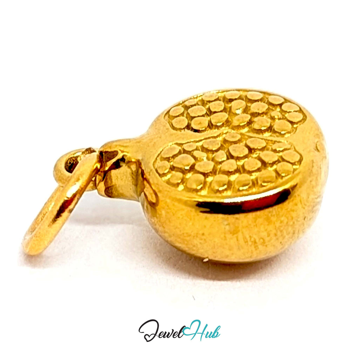 Angled view of the gold-tone pomegranate charm - JewelHub