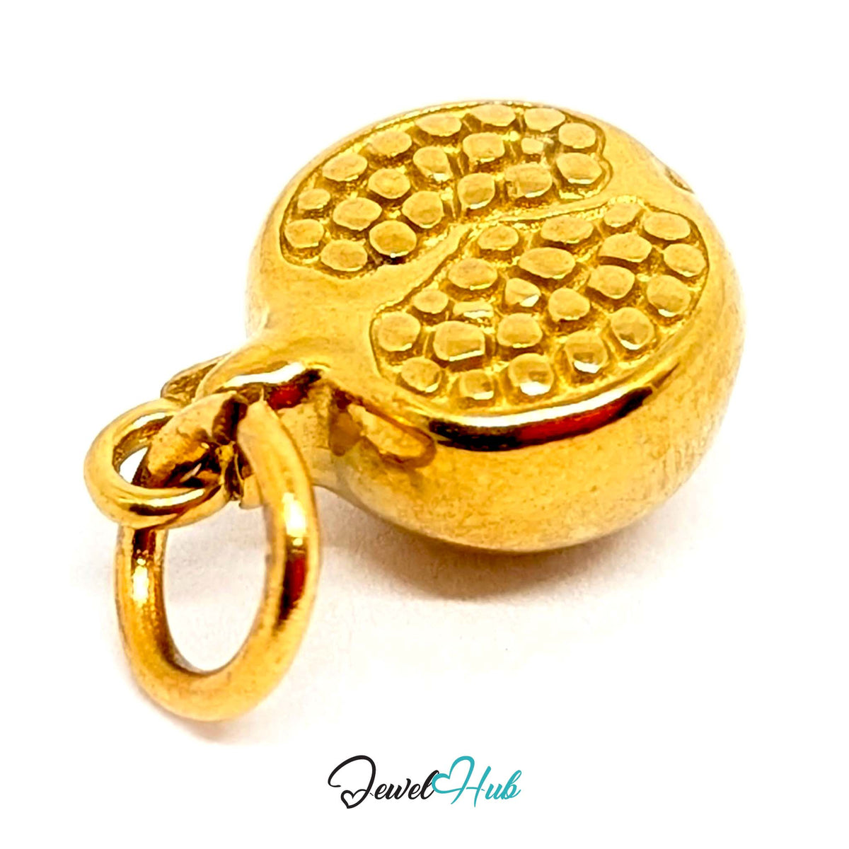Close-up of the gold-tone pomegranate charm detail - JewelHub