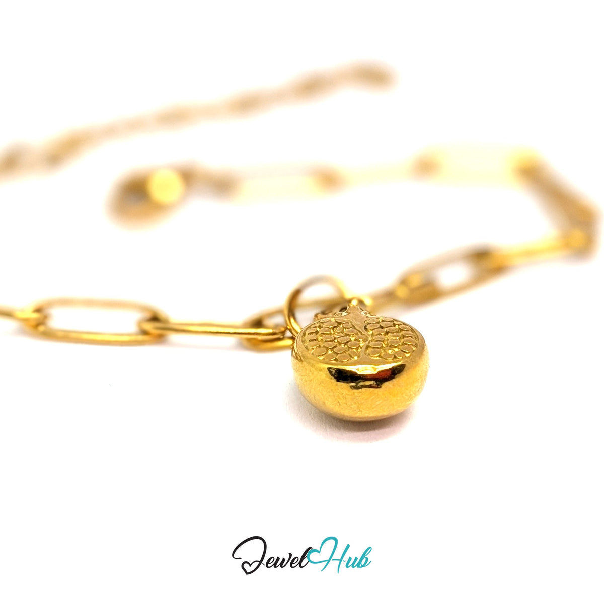 Gold-tone pomegranate charm styled on a gold paperclip chain bracelet - JewelHub