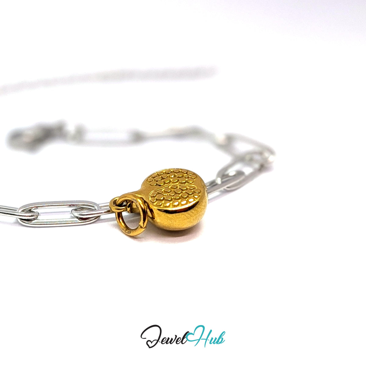 Gold-tone pomegranate charm styled on a silver paperclip chain bracelet for a two-tone look - JewelHub
