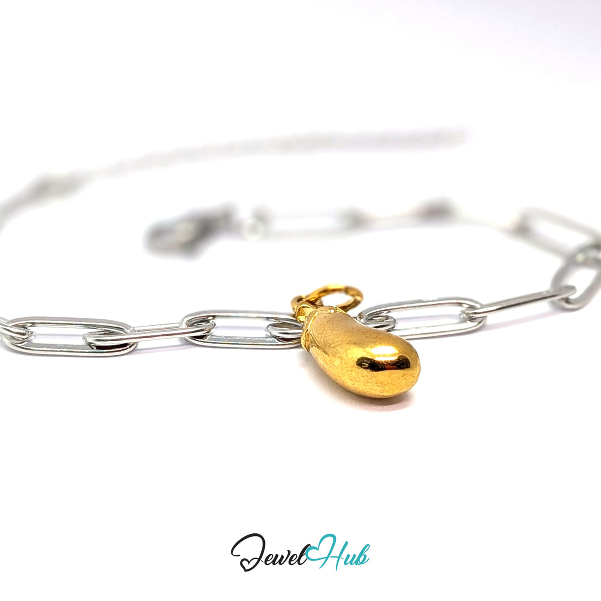 Gold-tone aubergine charm styled on a silver paperclip chain bracelet for a two-tone look - JewelHub