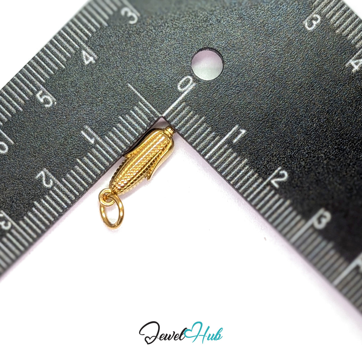 Corn on the cob charm measured against a ruler at 6mm wide by 17.7mm tall - JewelHub