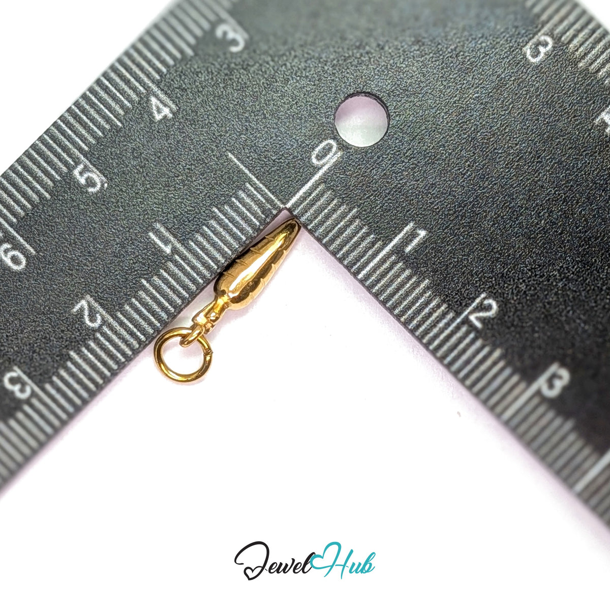 Mini carrot charm measured against a ruler at 4.2mm wide by 17.6mm tall - JewelHub