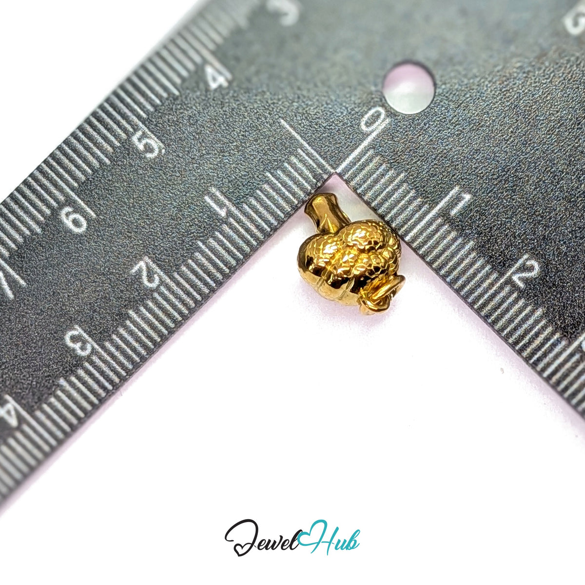3D broccoli charm measured against a ruler at 11.8mm wide by 15mm tall - JewelHub