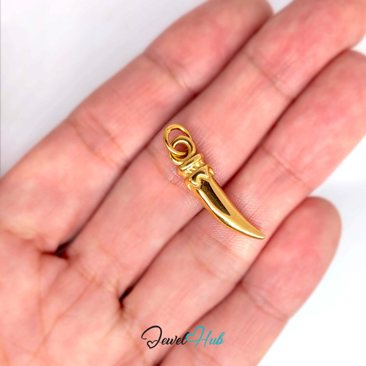 Large long pepper charm held in a hand to show its size - JewelHub