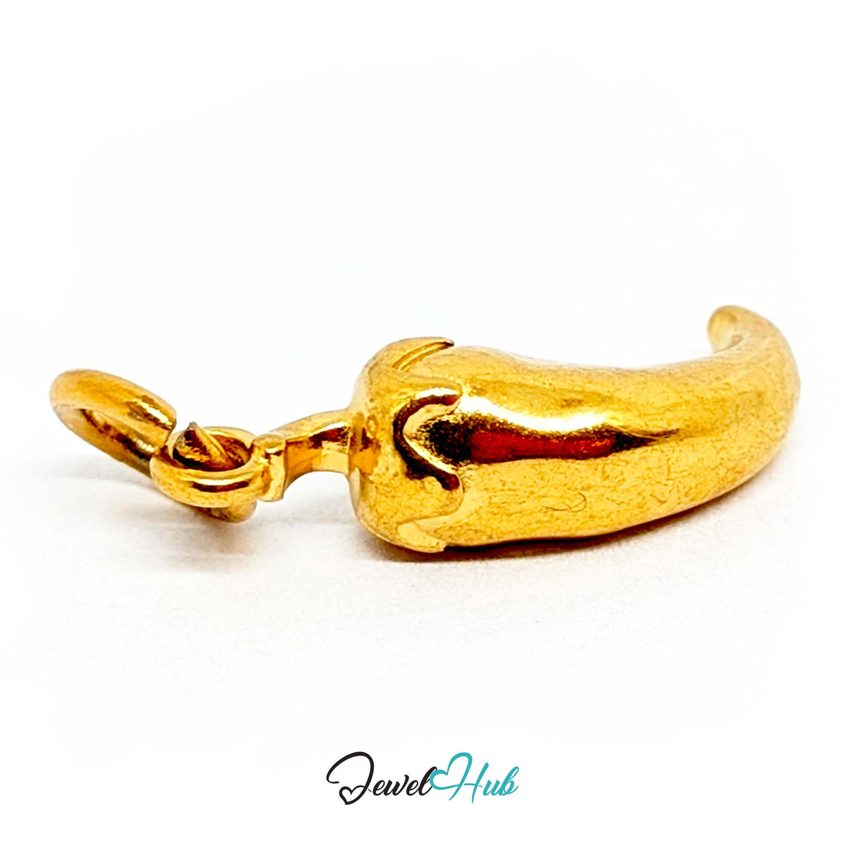 Close-up of the gold-tone curved chilli pepper charm detail - JewelHub