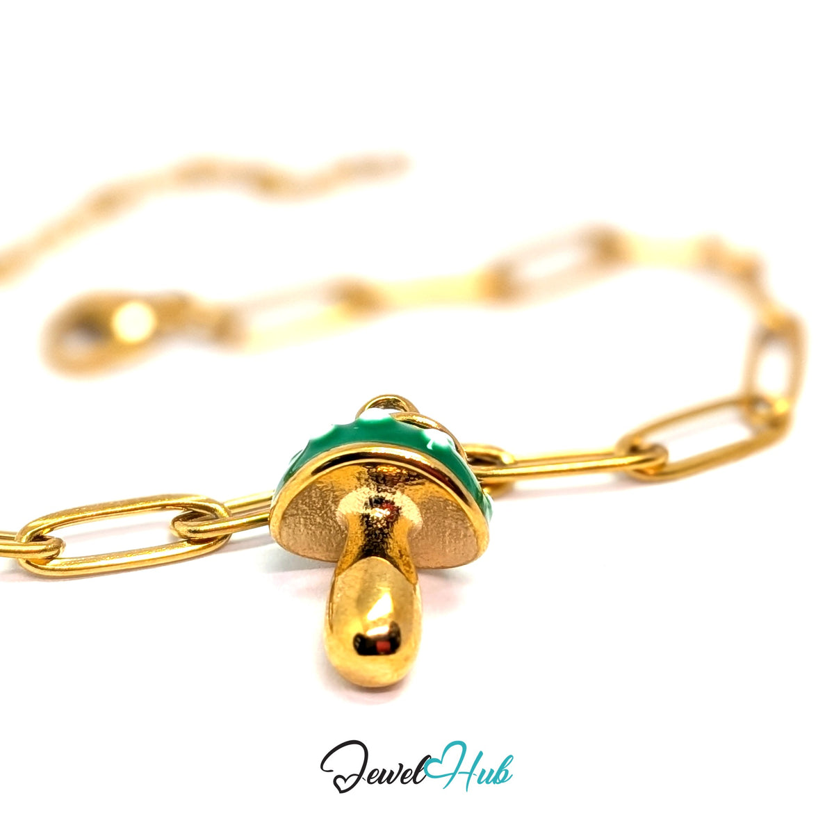 Gold-tone green spotted mushroom charm styled on a gold paperclip chain bracelet - JewelHub