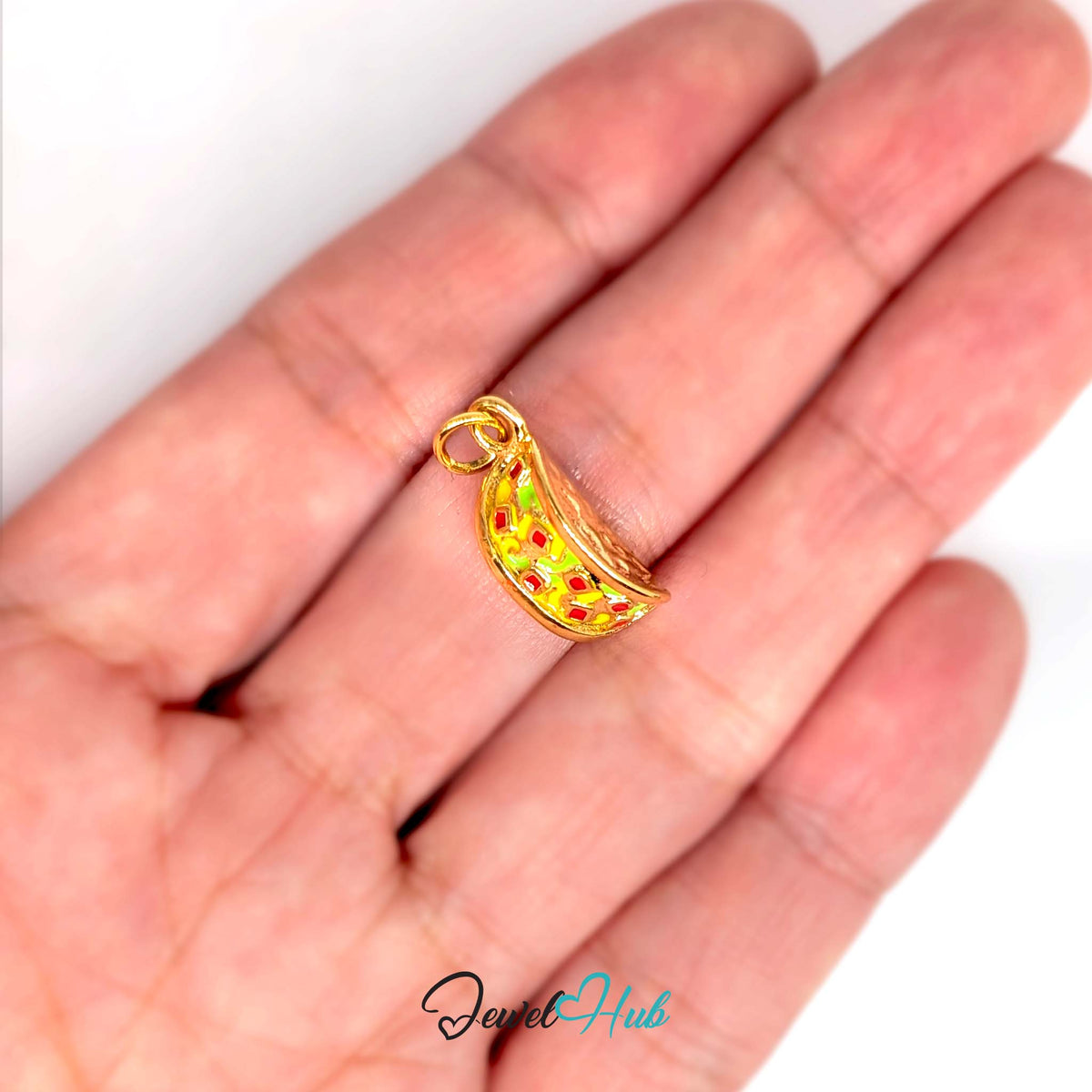 Taco charm held in a hand to show its size - JewelHub