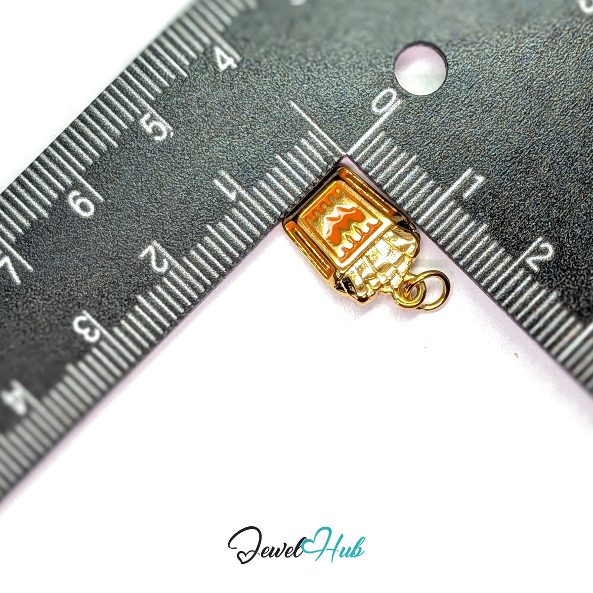 Orange enamel French fries charm measured against a ruler at 10.6mm wide by 16.7mm tall - JewelHub