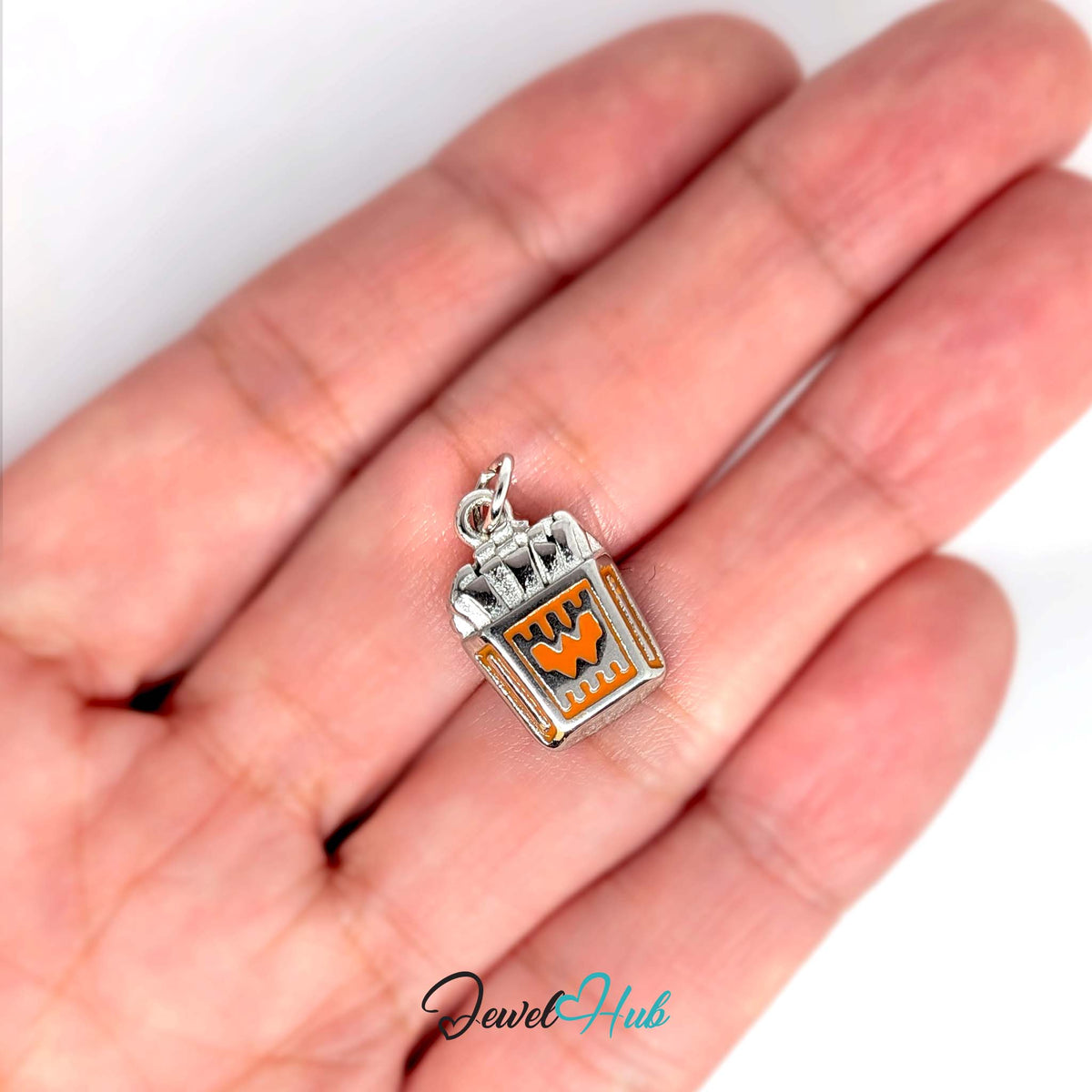 Orange enamel French fries charm held in a hand to show its size - JewelHub