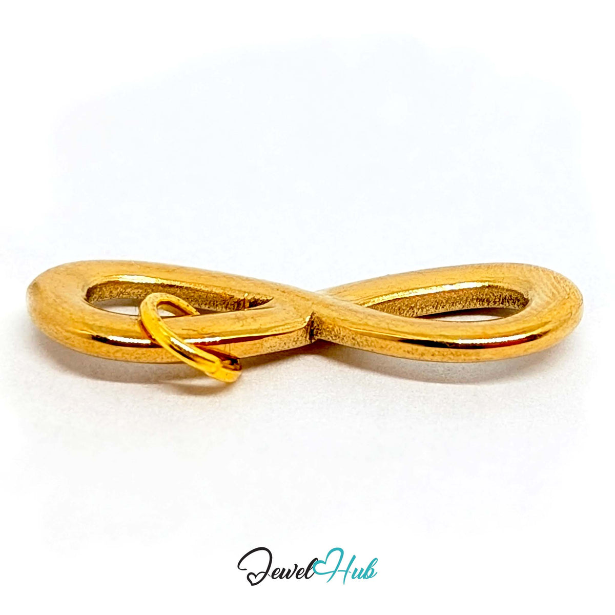 Close-up of the gold-tone infinity charm detail - JewelHub