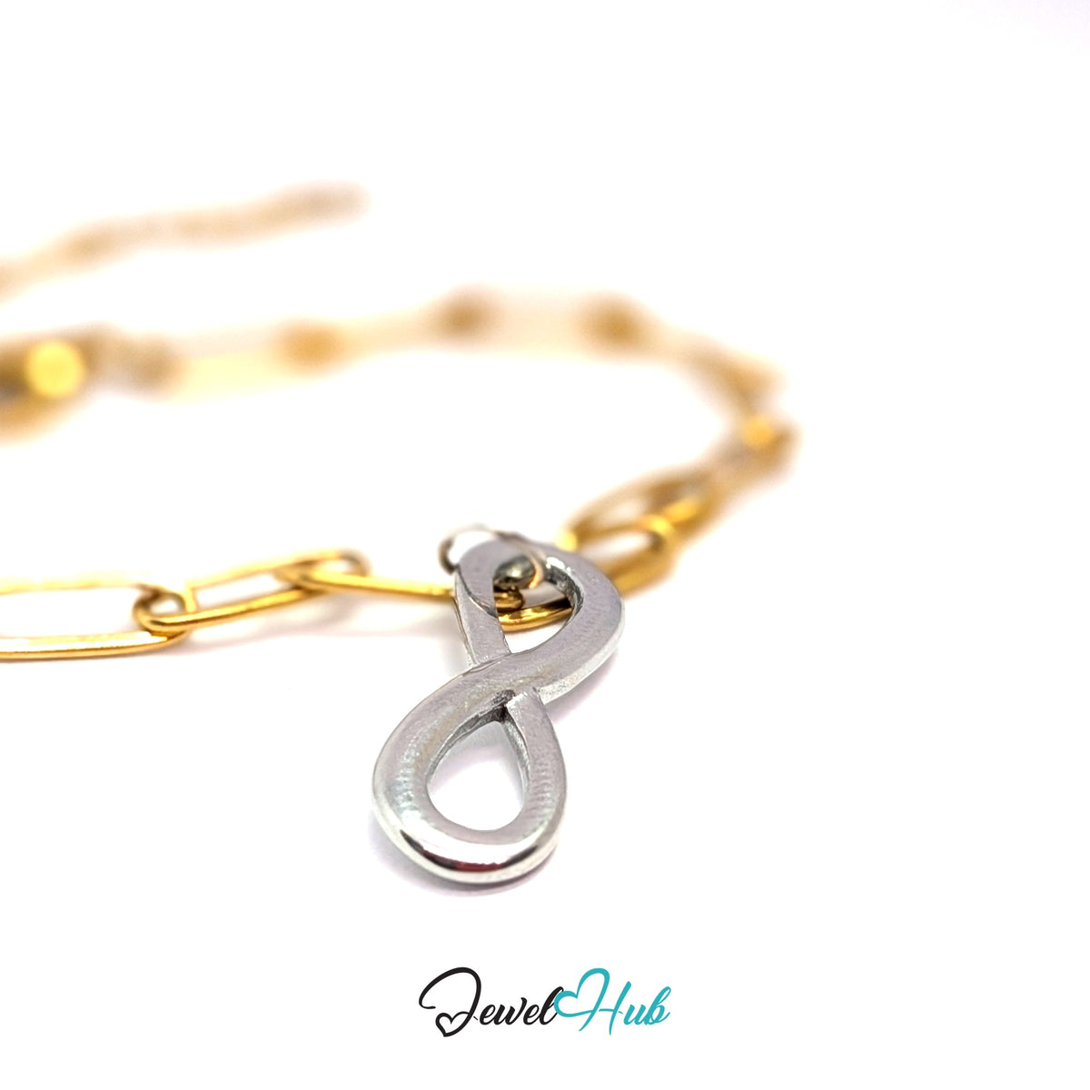 Silver-tone infinity charm styled on a gold paperclip chain bracelet for a two-tone look - JewelHub
