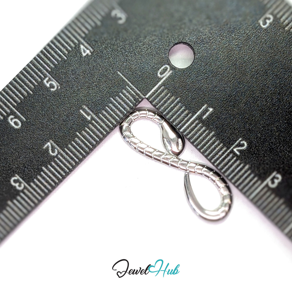 Infinity snake charm measured against a ruler at 10mm wide by 30.3mm tall - JewelHub