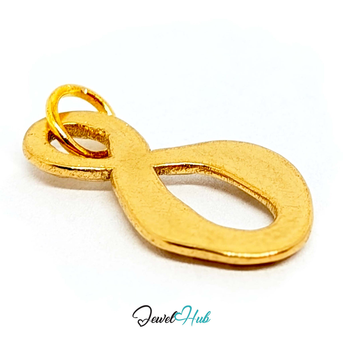 Close-up of the gold-tone textured infinity charm detail - JewelHub
