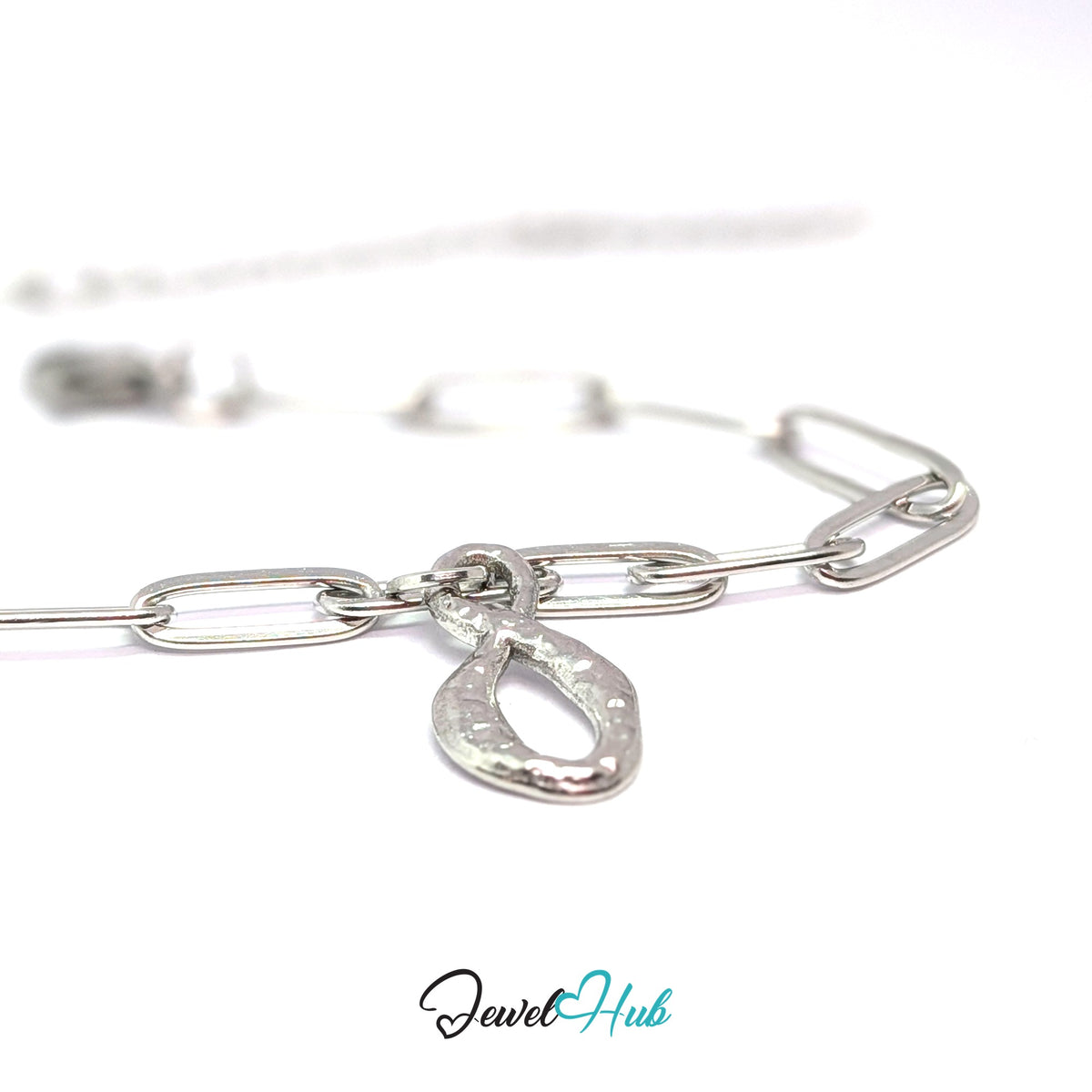 Silver-tone textured infinity charm styled on a silver paperclip chain bracelet - JewelHub