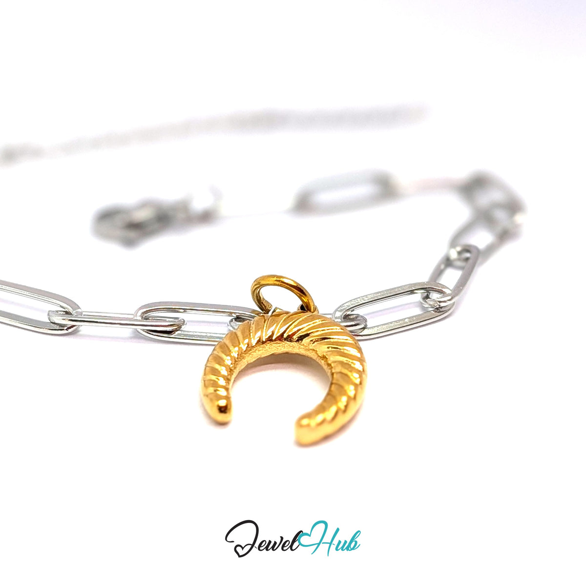 Gold-tone ribbed horseshoe charm styled on a silver paperclip chain bracelet for a two-tone look - JewelHub