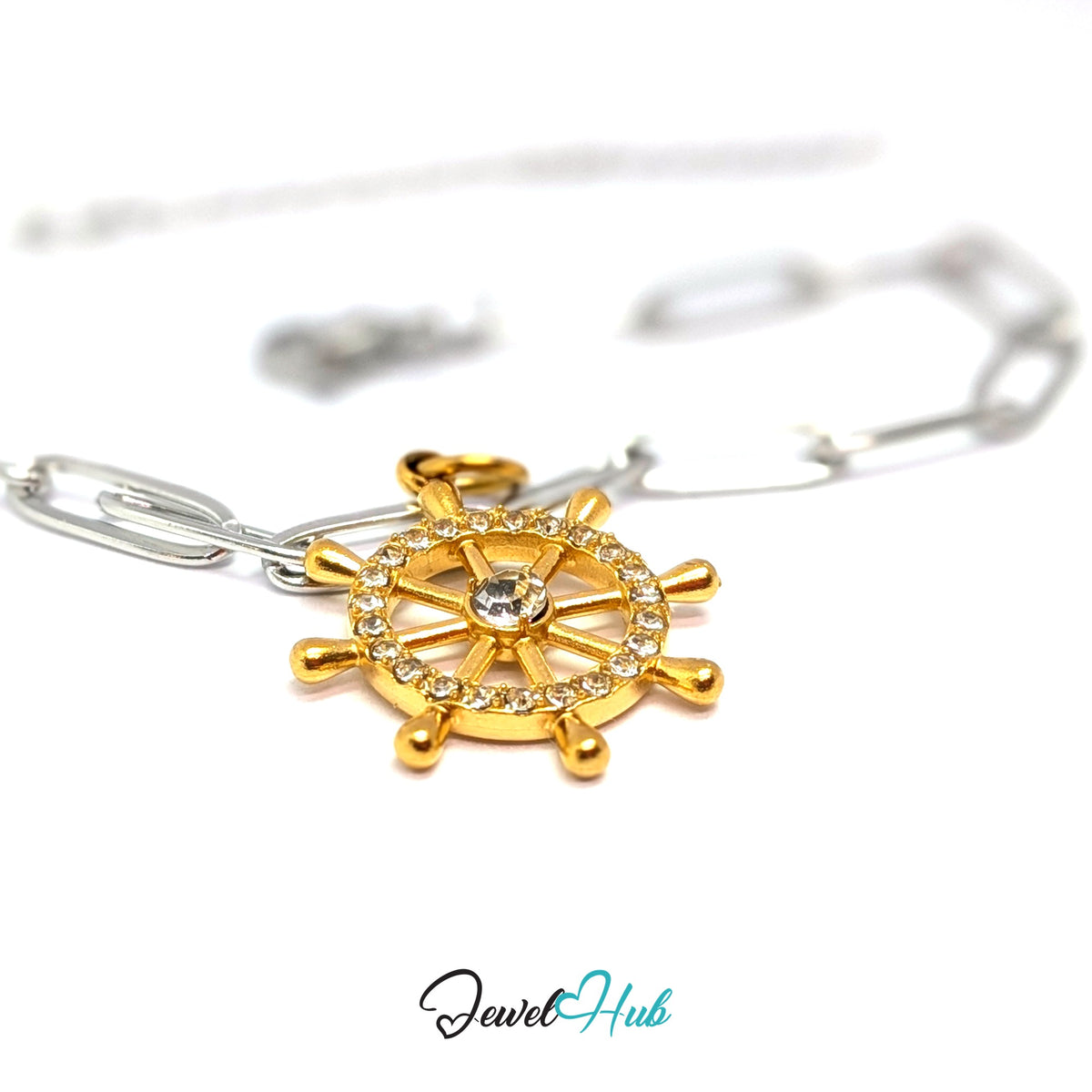 Gold-tone ship wheel charm styled on a silver paperclip chain bracelet for a two-tone look - JewelHub