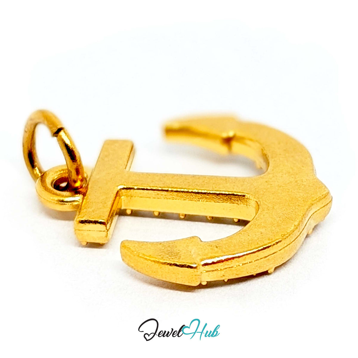 Close-up of the gold-tone crystal anchor charm detail - JewelHub
