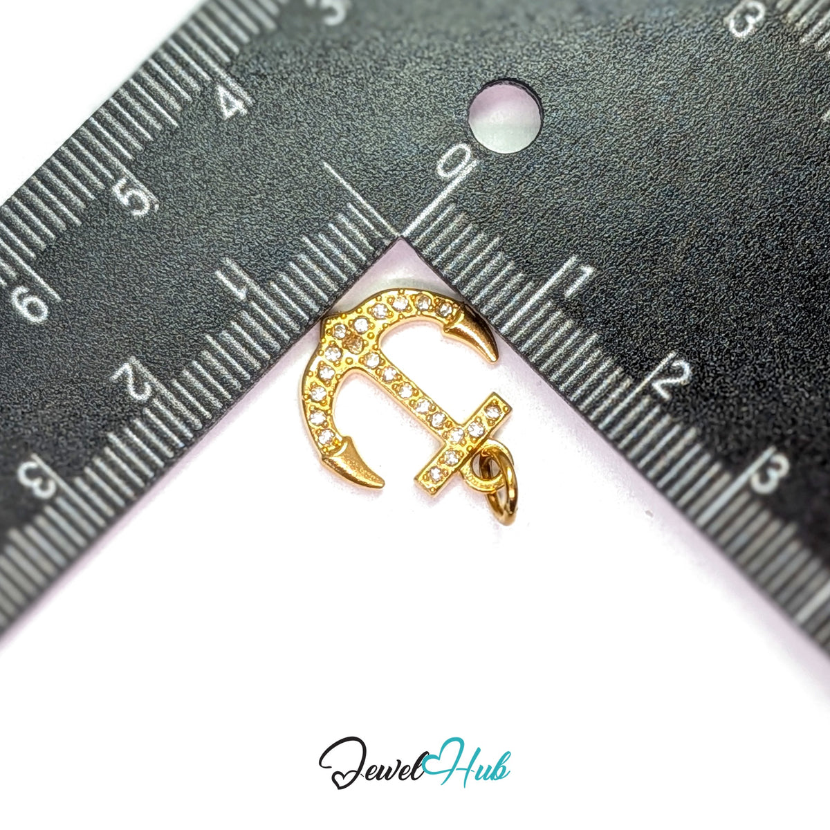 Crystal anchor charm measured against a ruler at 16mm wide by 17.2mm tall - JewelHub