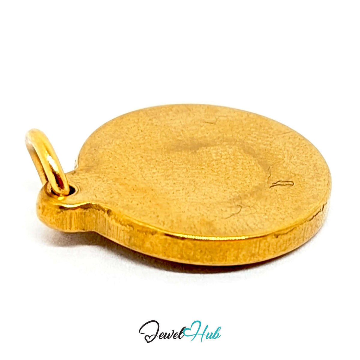 Close-up of the gold-tone sun medallion charm detail - JewelHub