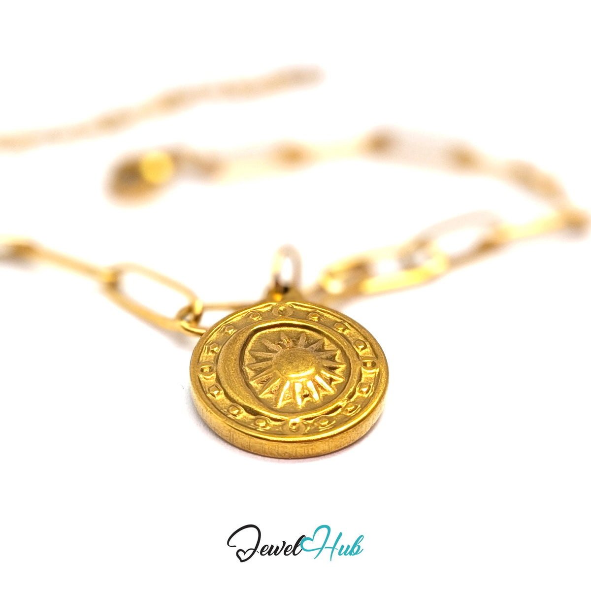 Gold-tone sun medallion charm styled on a gold paperclip chain bracelet - JewelHub