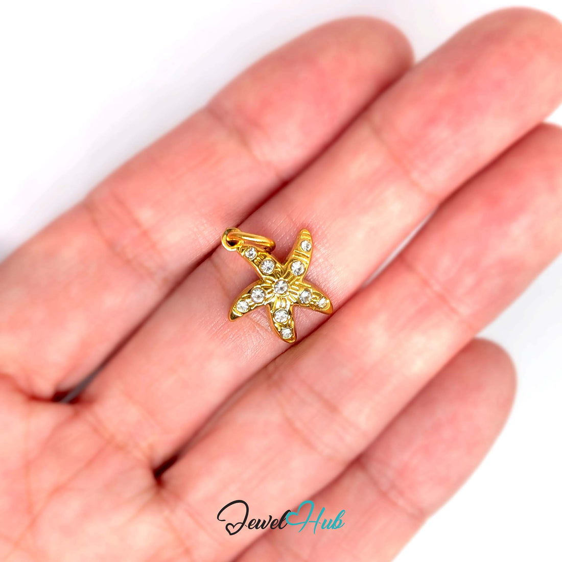 Crystal starfish charm in gold-tone stainless steel, with clear glue-set crystals - JewelHub