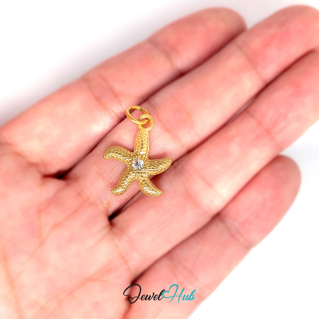 Textured starfish charm in gold-tone stainless steel, with clear glue-set crystals - JewelHub