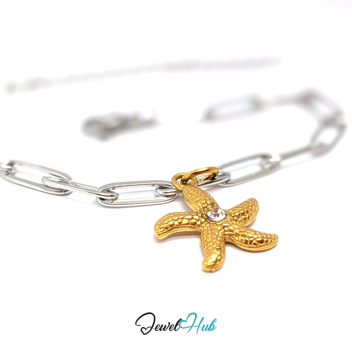 Gold-tone textured starfish charm styled on a silver paperclip chain bracelet for a two-tone look - JewelHub